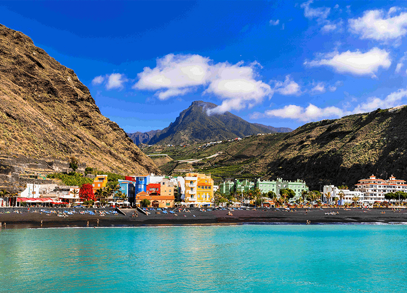 View of Puerto de Tazacorte with beach and mountains on La Palma island