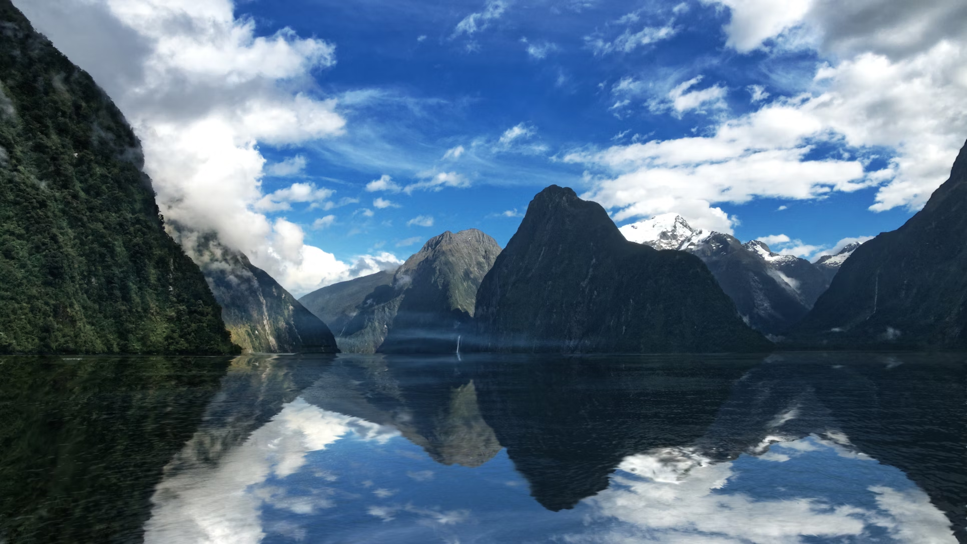 Milford Sound with mountains reflected in still water