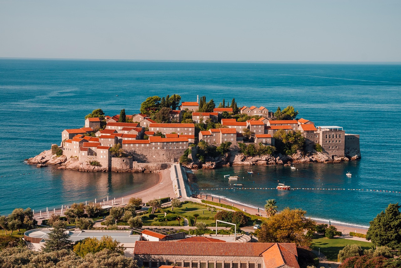 Scenic view of Sveti Stefan island connected to the mainland by a narrow isthmus