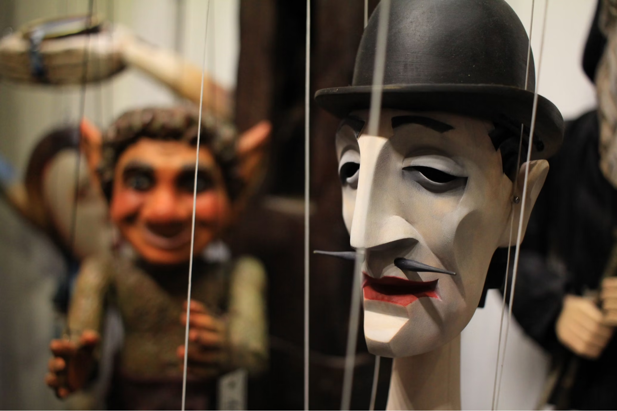 Close-up of traditional marionette puppets on display in Lyon museum