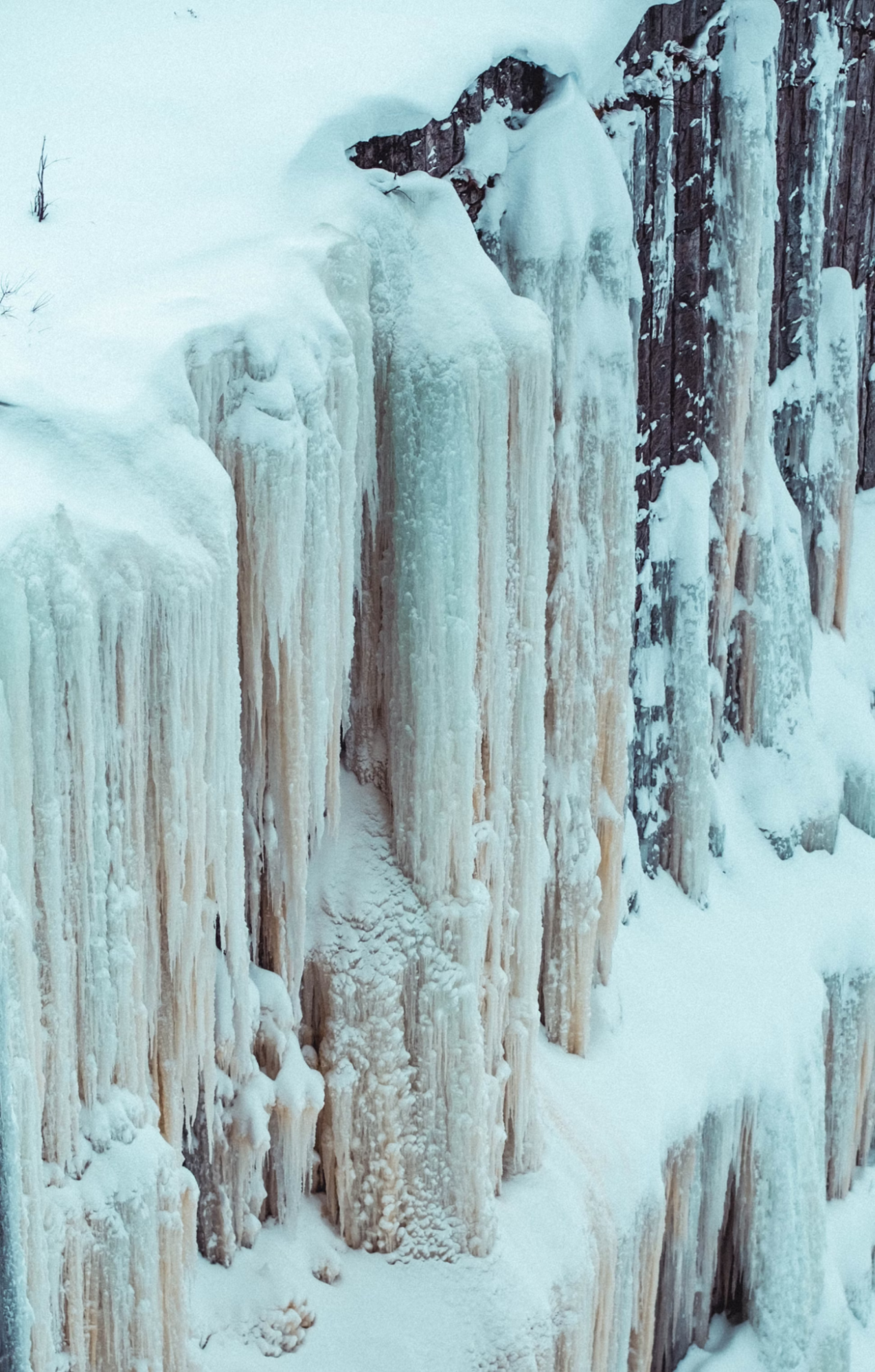 Frozen waterfalls and snow-covered cliffs in Korouoma Canyon, Lapland
