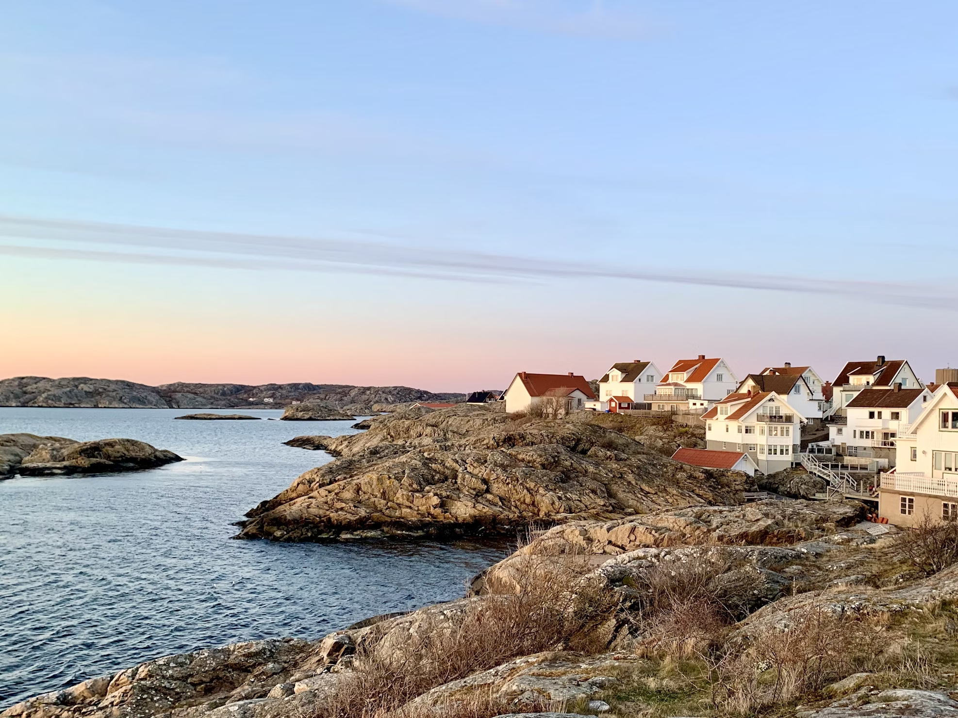 Coastal village on rocky shoreline in the Swedish archipelago at sunset<br />