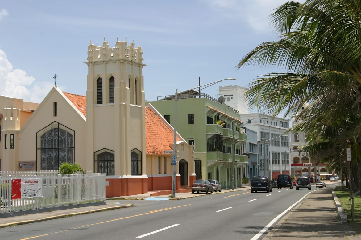 Street view of central Ponce with historic buildings and traffic