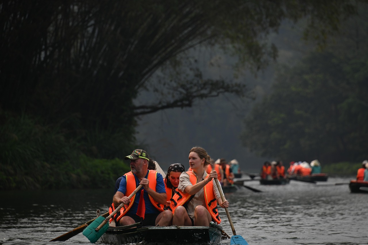 Tourists rowing a boat through a scenic river in northern Vietnam