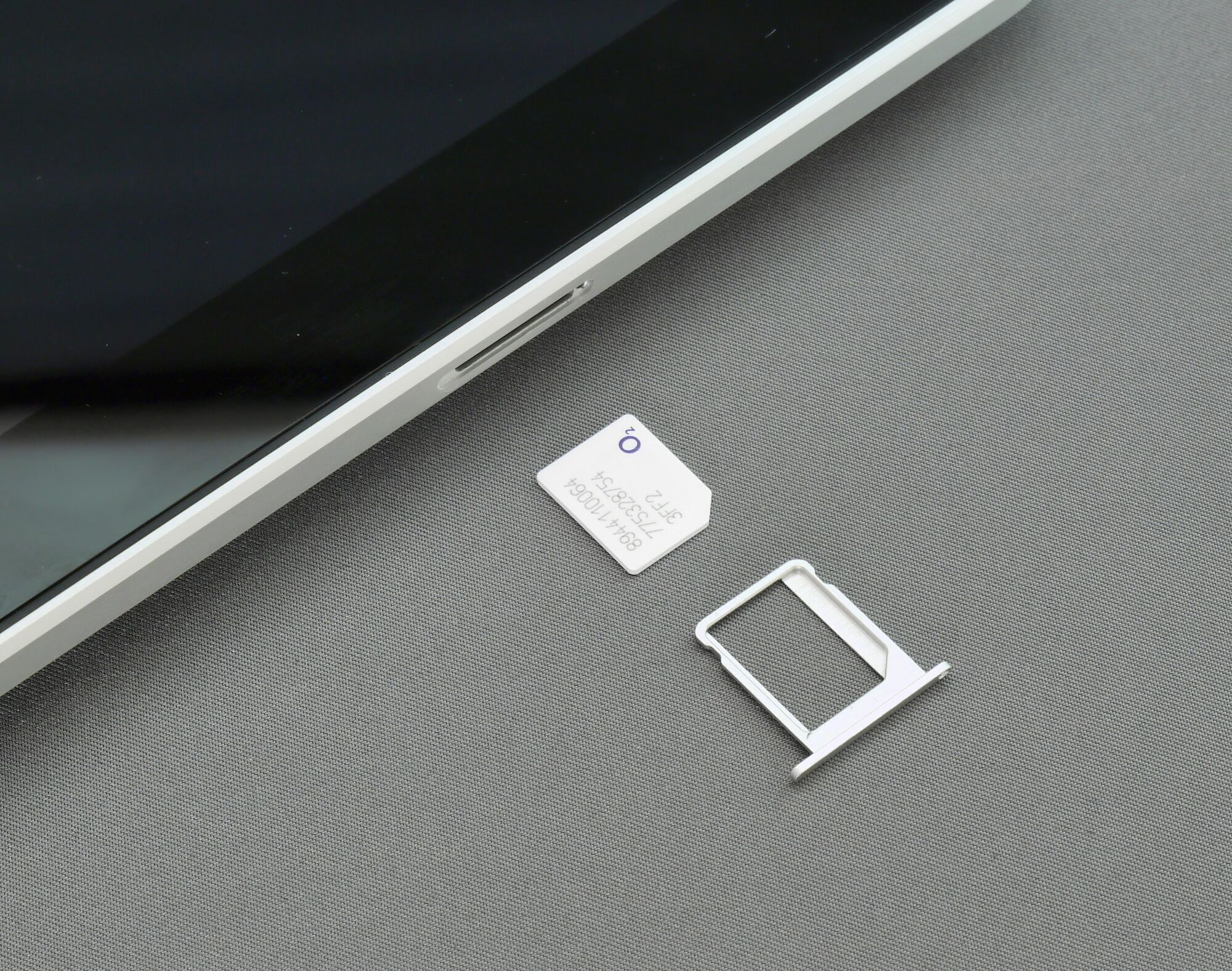 Close-up of phone with SIM card and tray