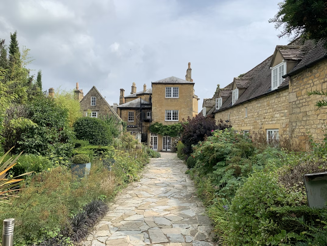 Stone path through historic Cotswold village in England