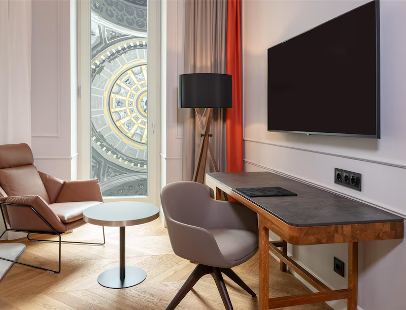 Hotel room interior with desk and Basilica dome view through the window