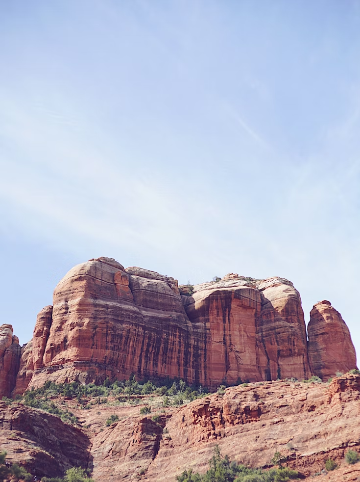 Red sandstone cliffs at Red Rock State Park under a clear sky