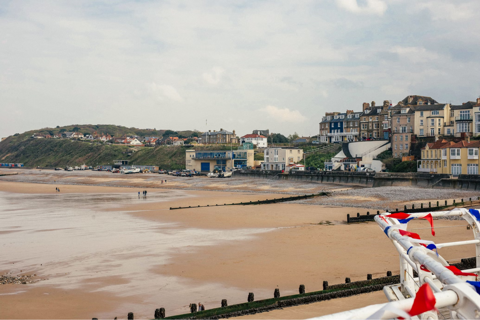 Cromer seafront and beach in Norfolk, East Anglia, with houses on the cliffs and lifeboat station visible