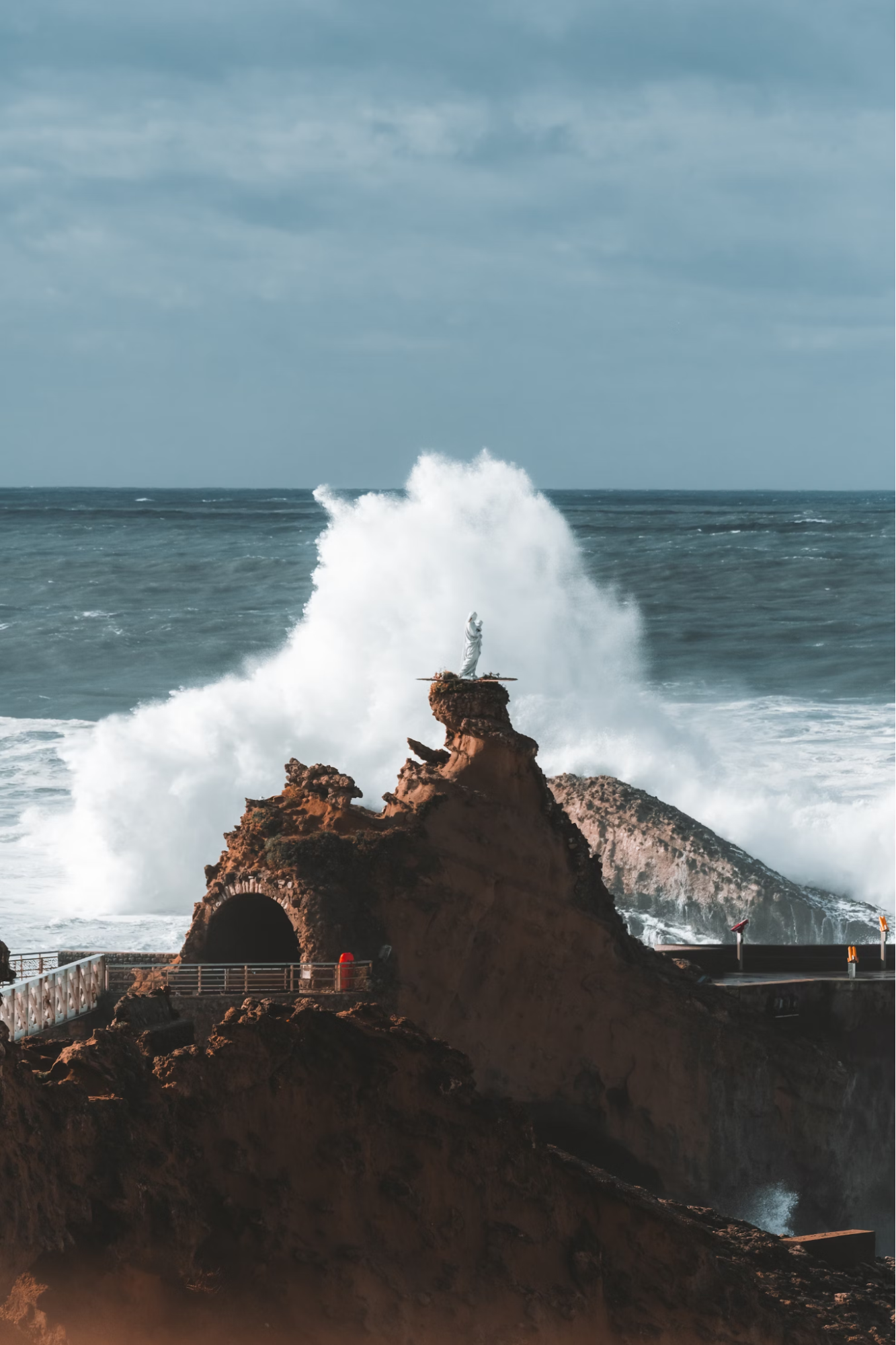Waves crashing against the Rock of the Virgin in Biarritz, France