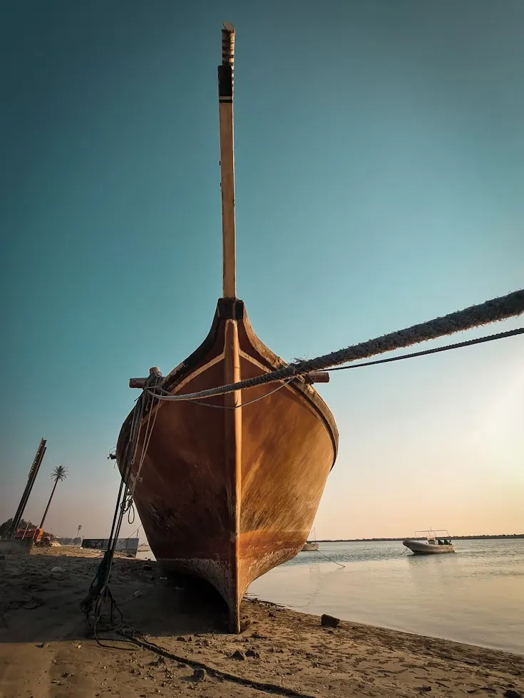 Traditional wooden boat on the shore in Dammam, Saudi Arabia