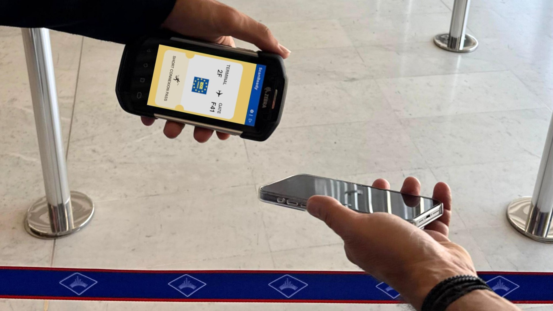 Passenger scanning mobile boarding pass at airport