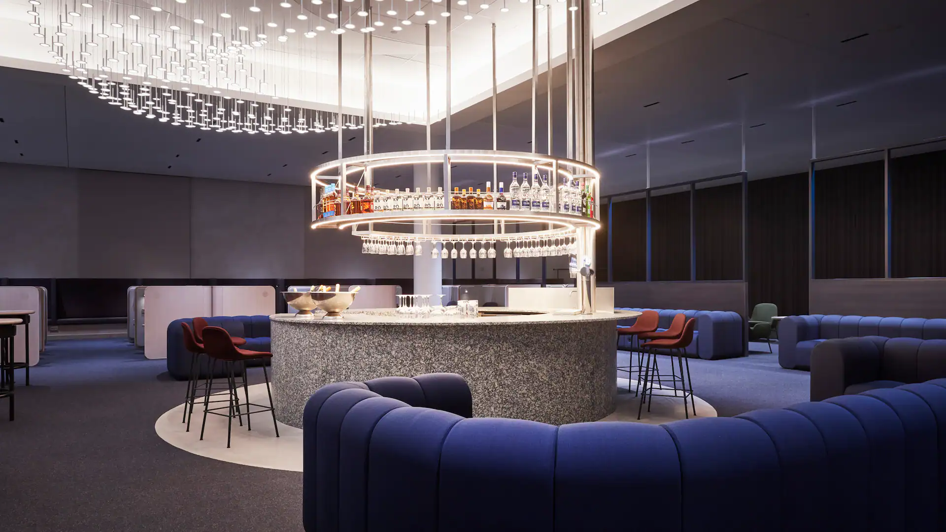Modern circular bar surrounded by lounge seating in Helsinki Airport’s redesigned non-Schengen lounge
