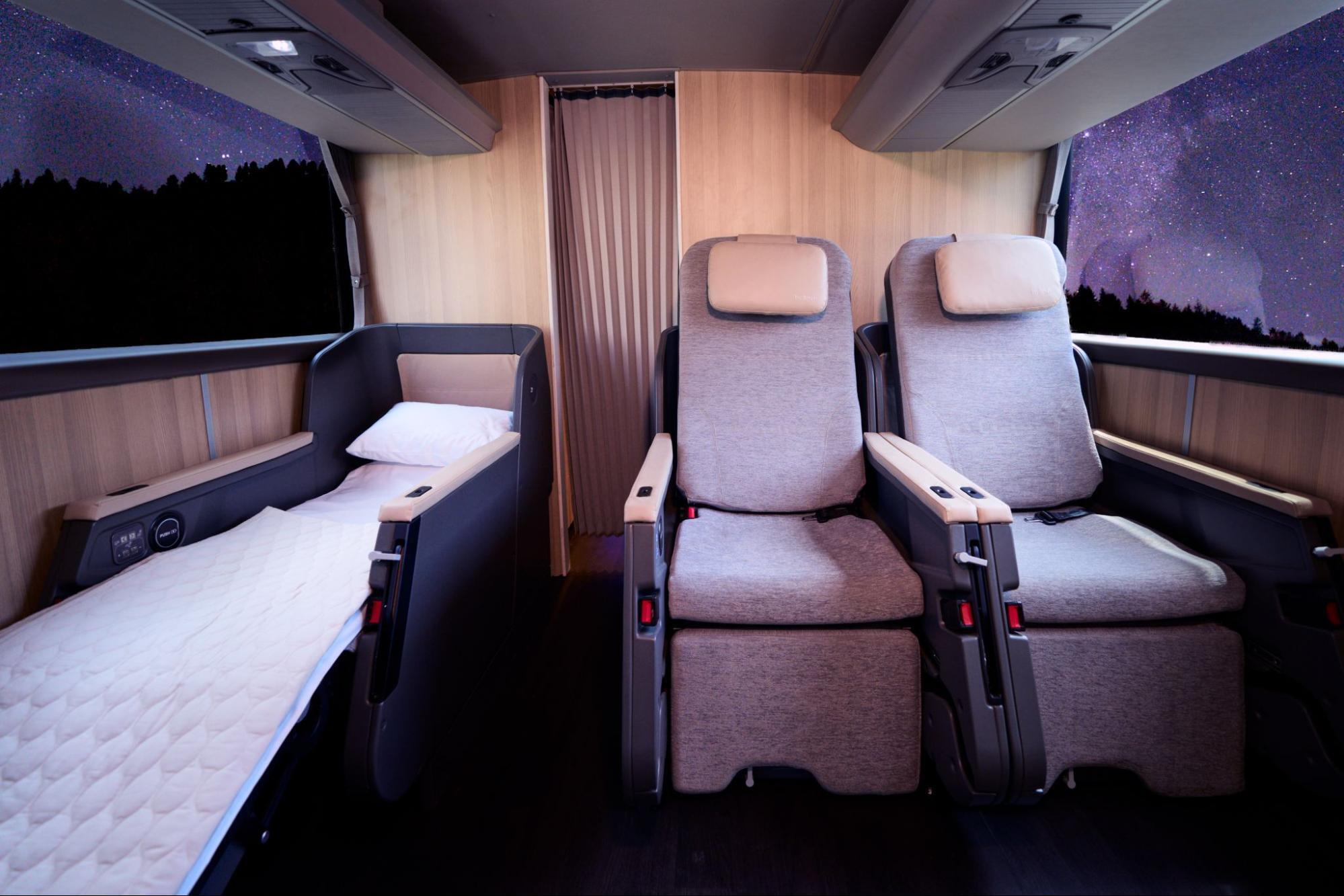 Reclining seats and bed inside Twiliner night bus