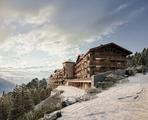 Alpine hotel surrounded by snowy mountains