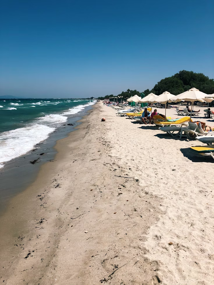Sunny beach with umbrellas on Kos island