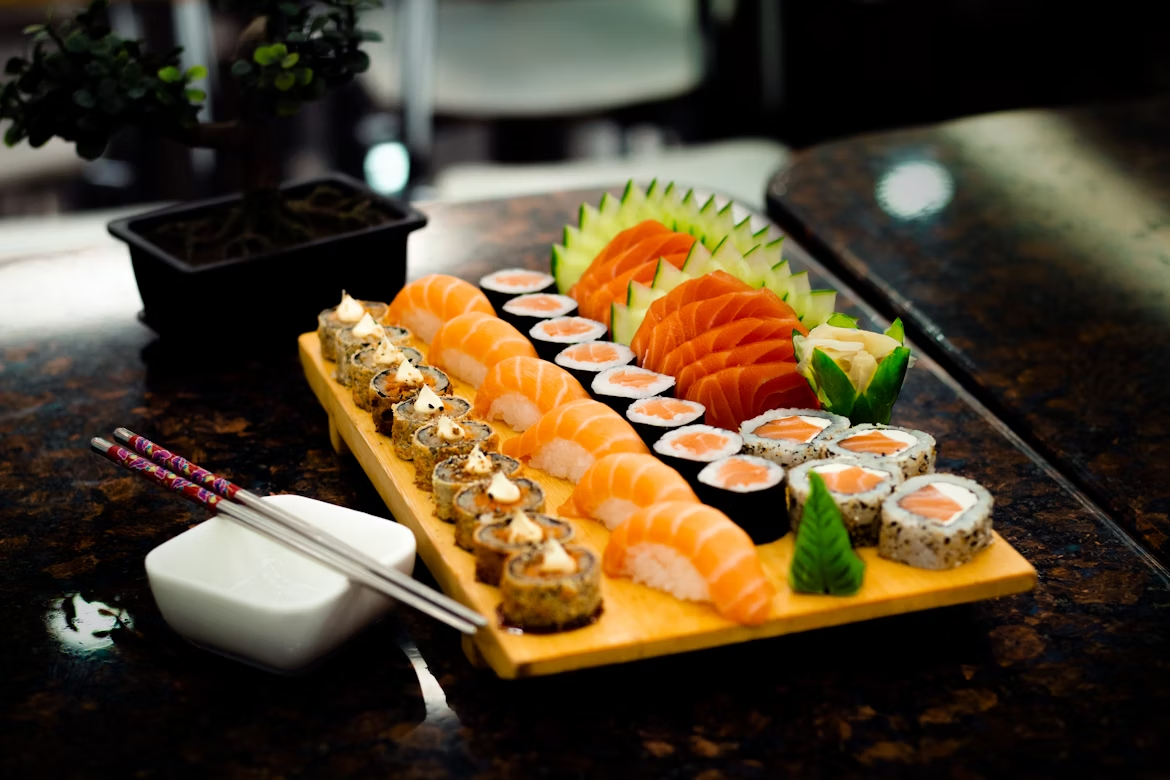 Assorted sushi platter on wooden board
