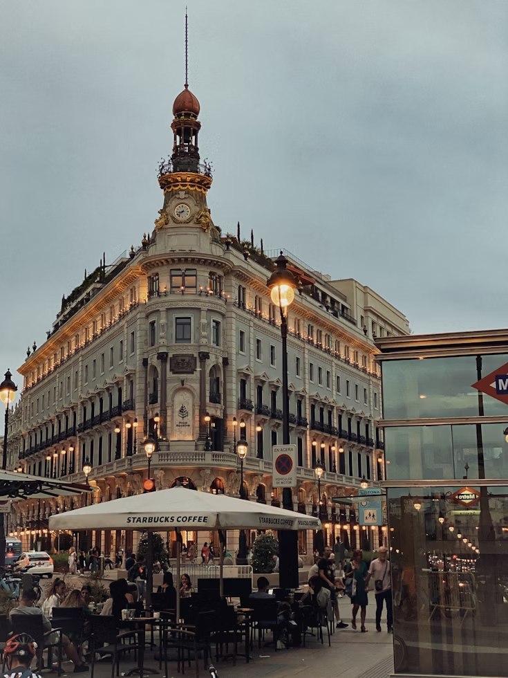 Elegant facade of the Four Seasons Hotel in central Madrid at dusk