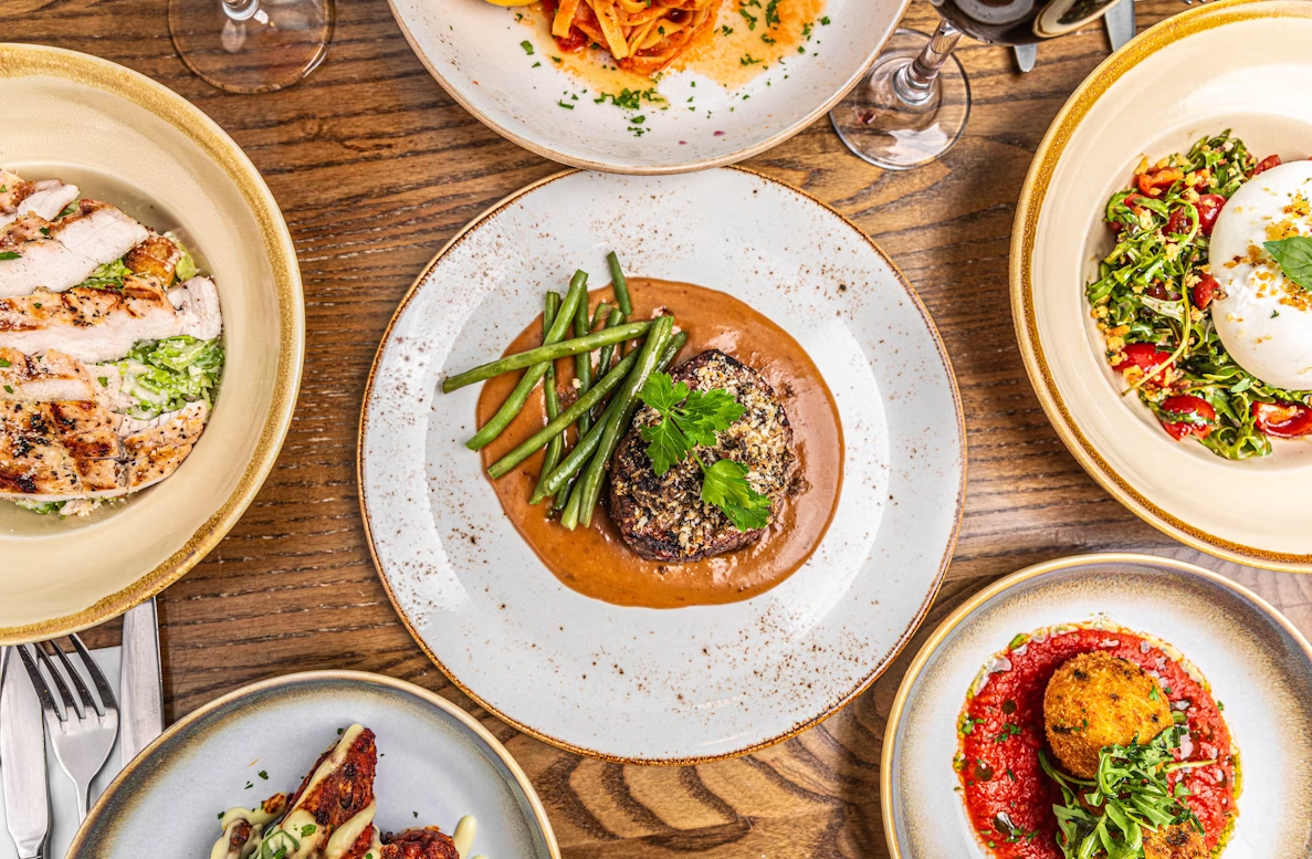 Assorted gourmet dishes on a wooden table