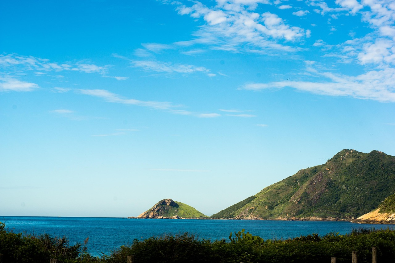 Scenic view of Grumari Beach in Rio de Janeiro with green hills and blue ocean