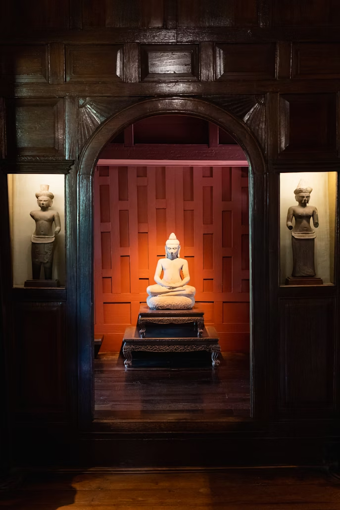 Interior of Jim Thompson House featuring Buddha statue