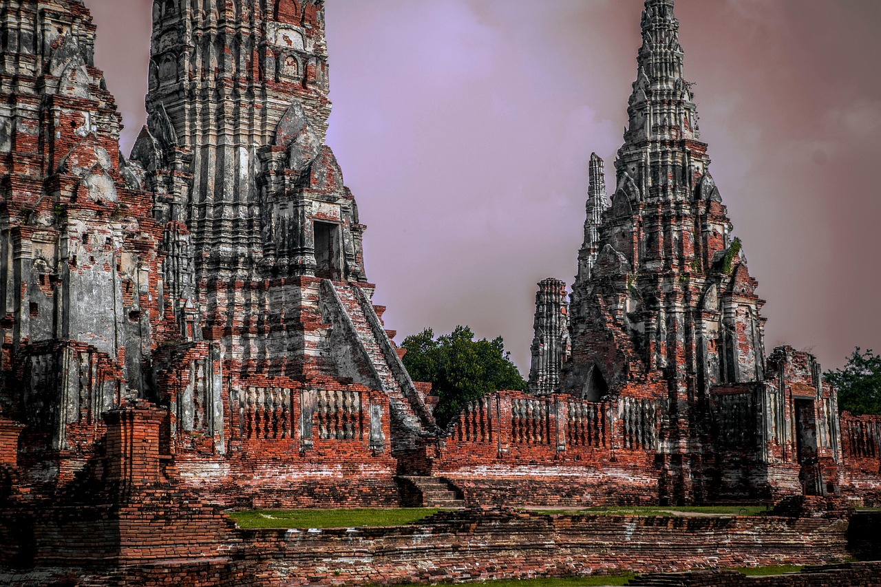 Ancient temple structures near waterfalls in Thailand