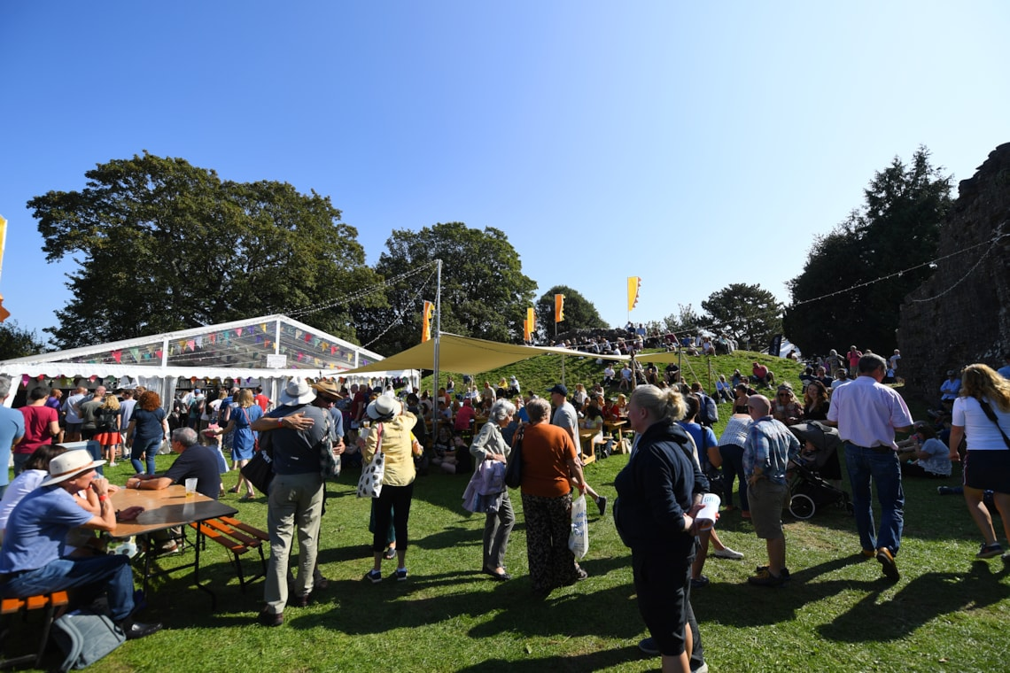 Visitors enjoying Abergavenny Food Festival outdoors