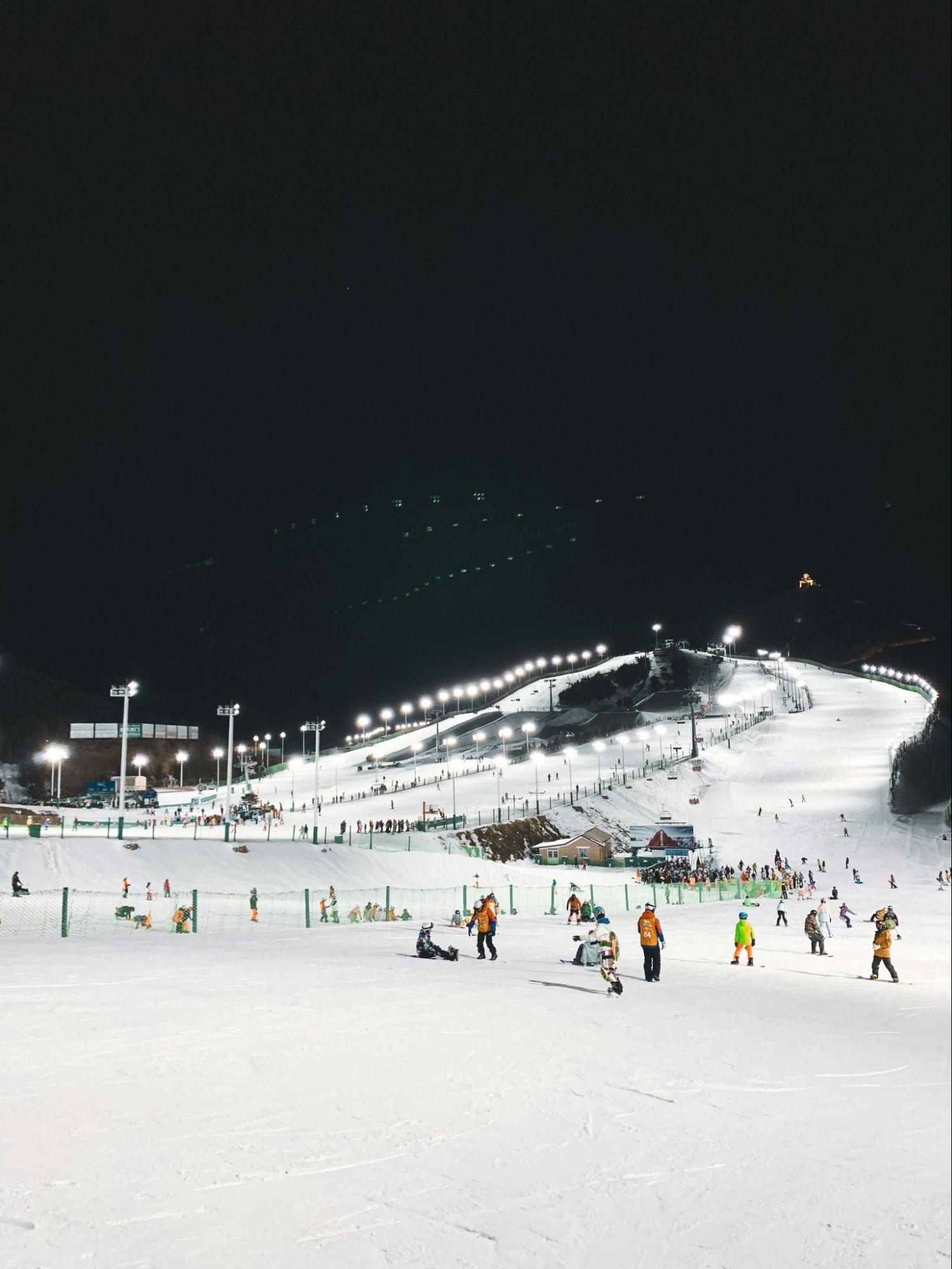Night skiing slope with lights