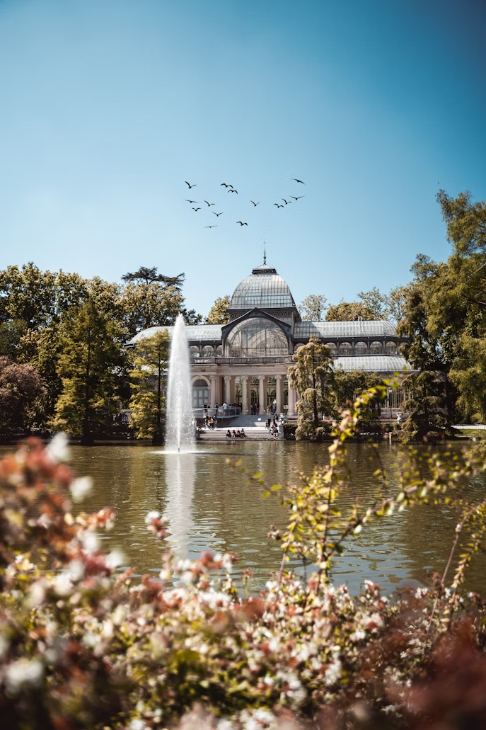 Retiro Park with fountain and glass palace in Madrid