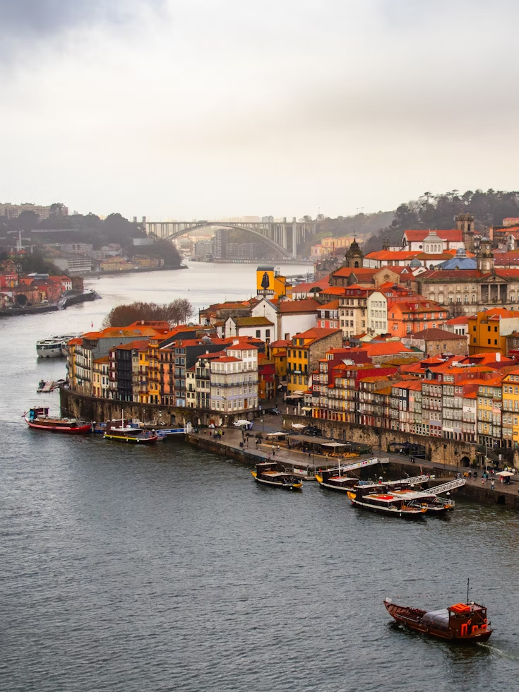 Colorful riverside buildings and boats in Vila Nova de Gaia, Portugal