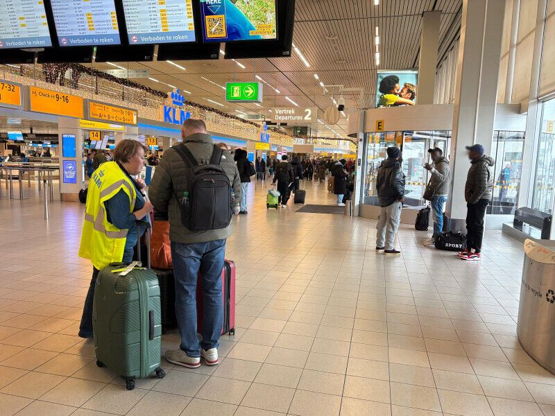 Passengers inside Schiphol Terminal