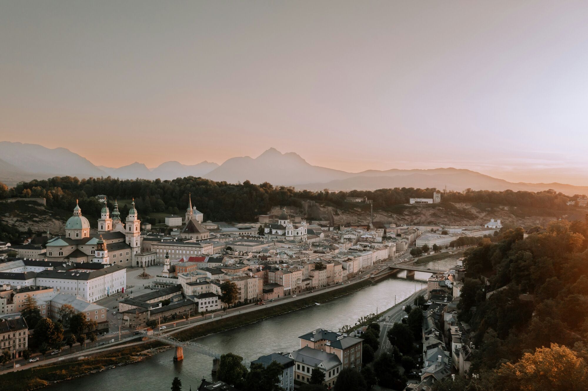 Salzburg city with mountains at sunset