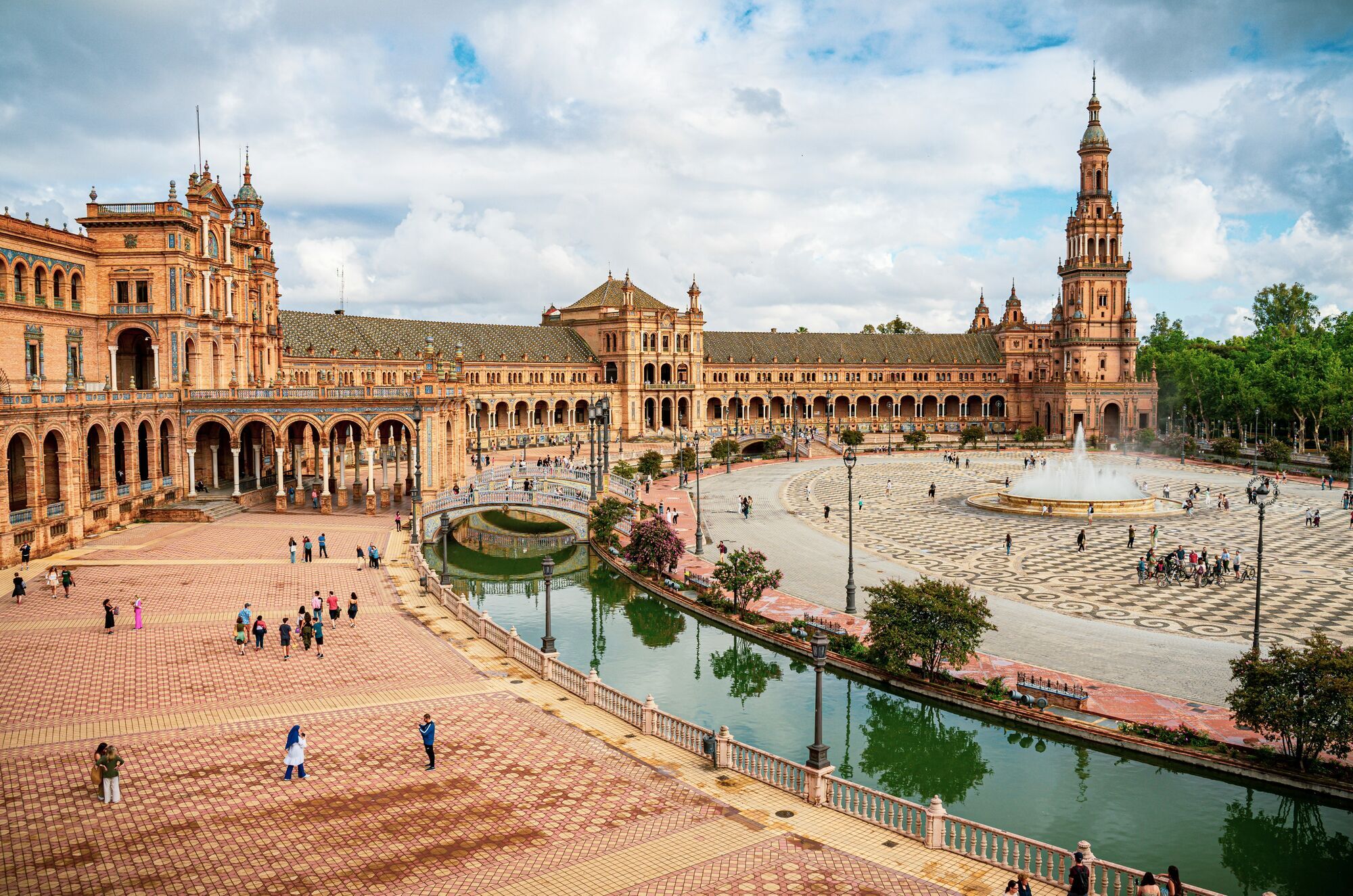 Plaza de España in Seville with visitors walking across the square