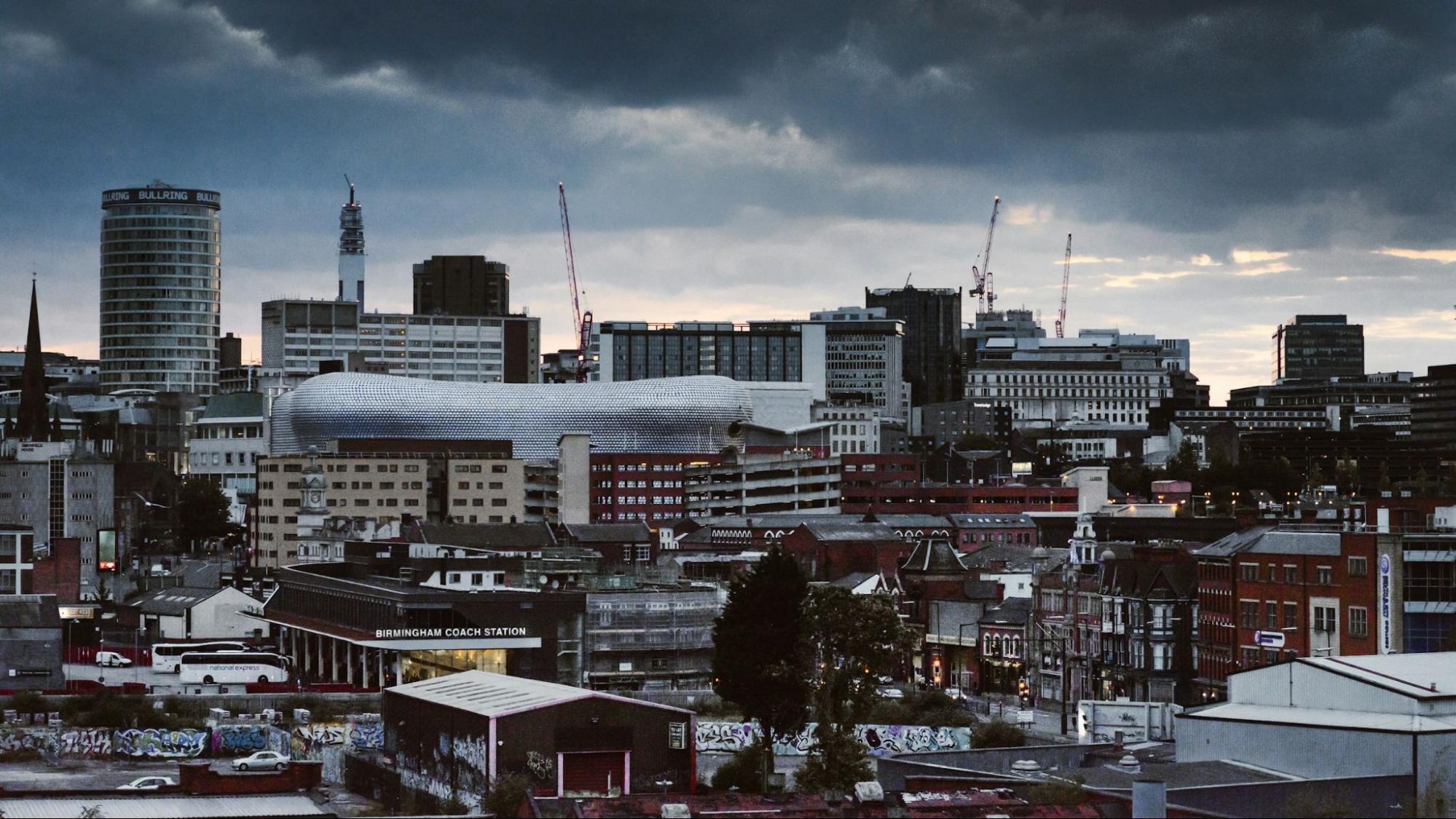Birmingham city skyline under cloudy skies