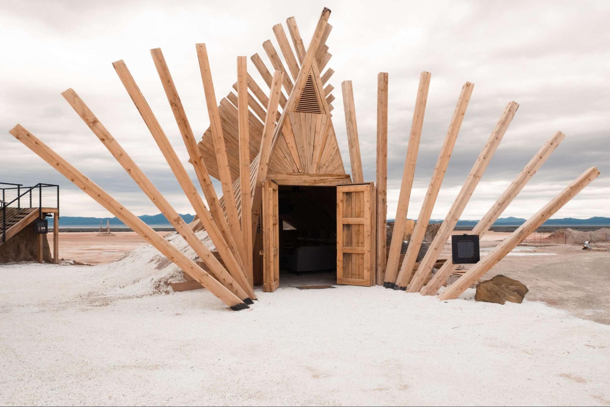 Sculptural wooden entrance to cave-style unit at OutpostX