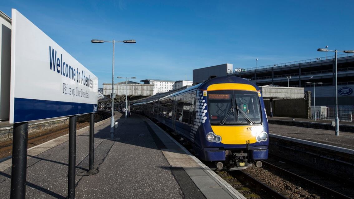 Train at Aberdeen Station platform on a clear day