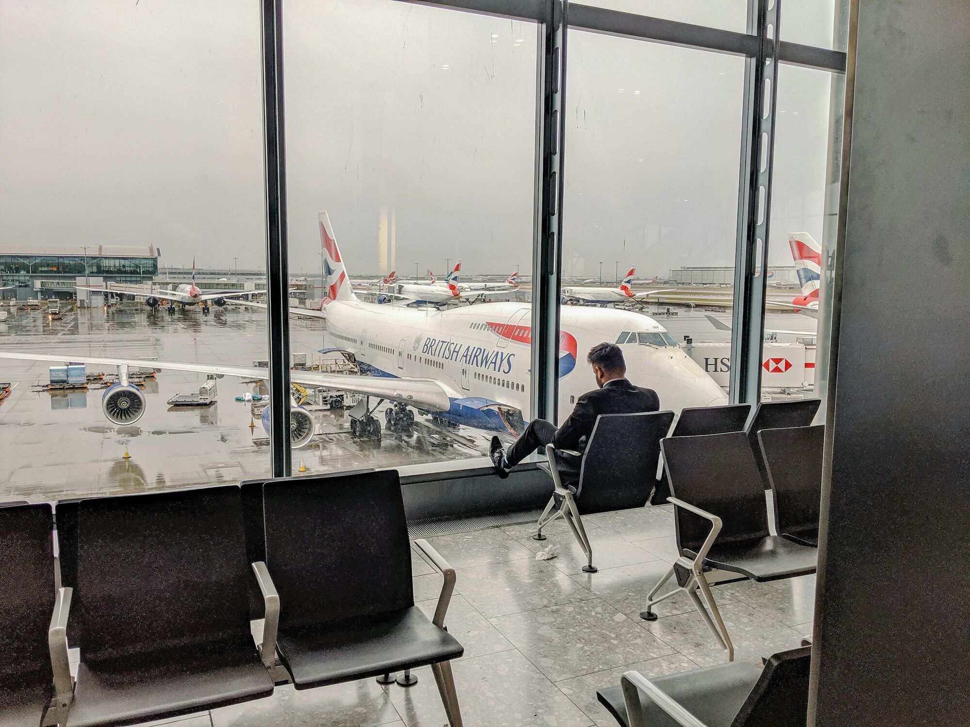 British Airways aircraft seen from Heathrow terminal seating area