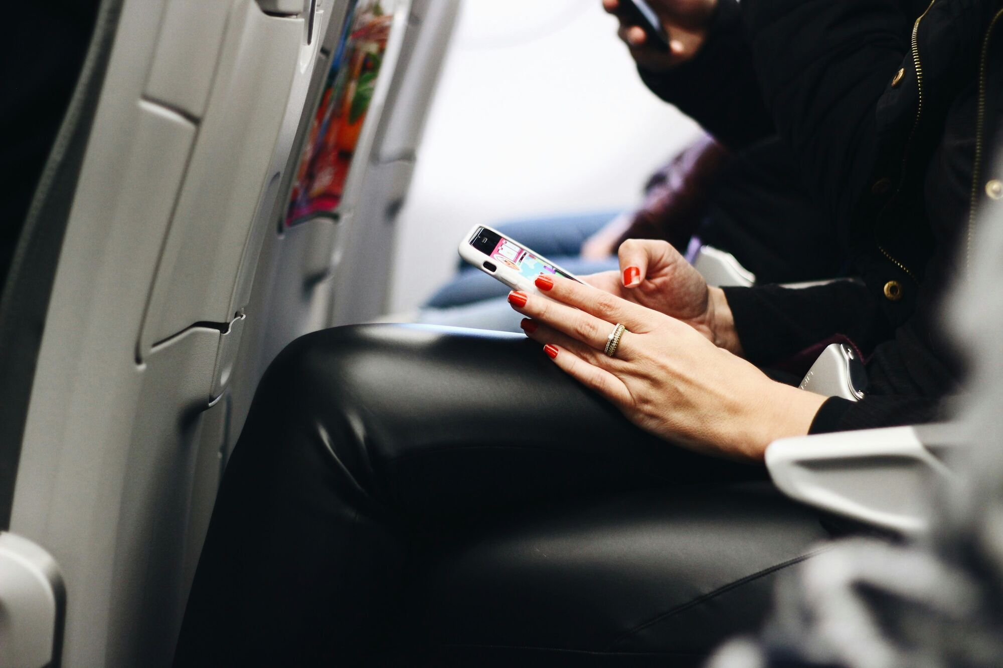 Passenger using a smartphone onboard a commercial aircraft