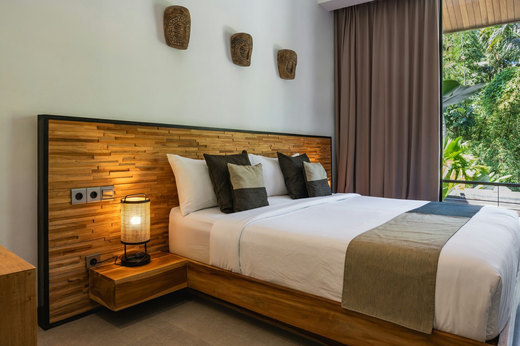 Modern hotel bedroom with wooden furnishings