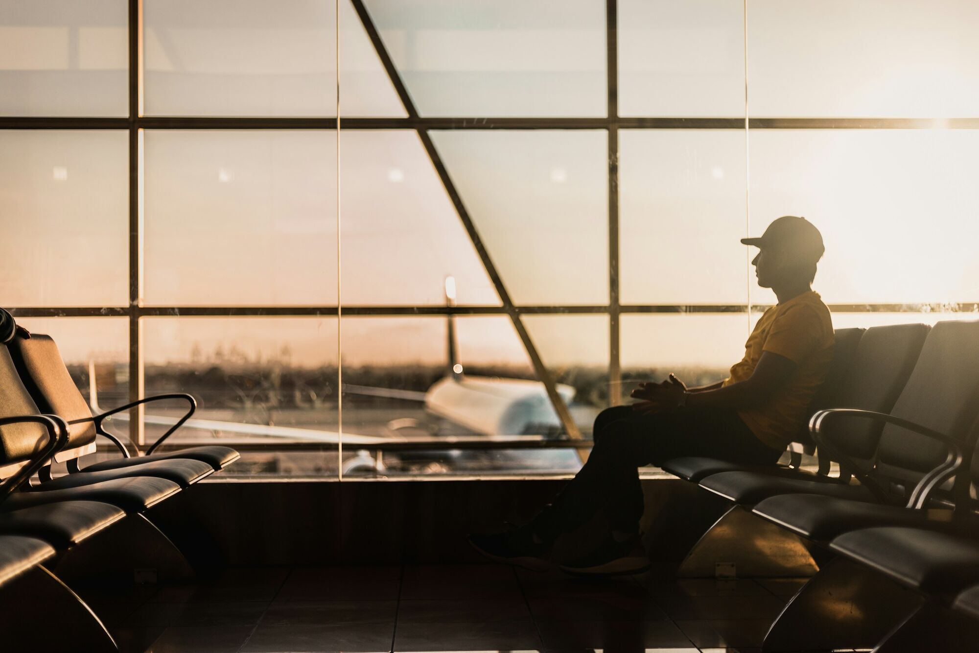 Passenger waiting alone inside airport terminal