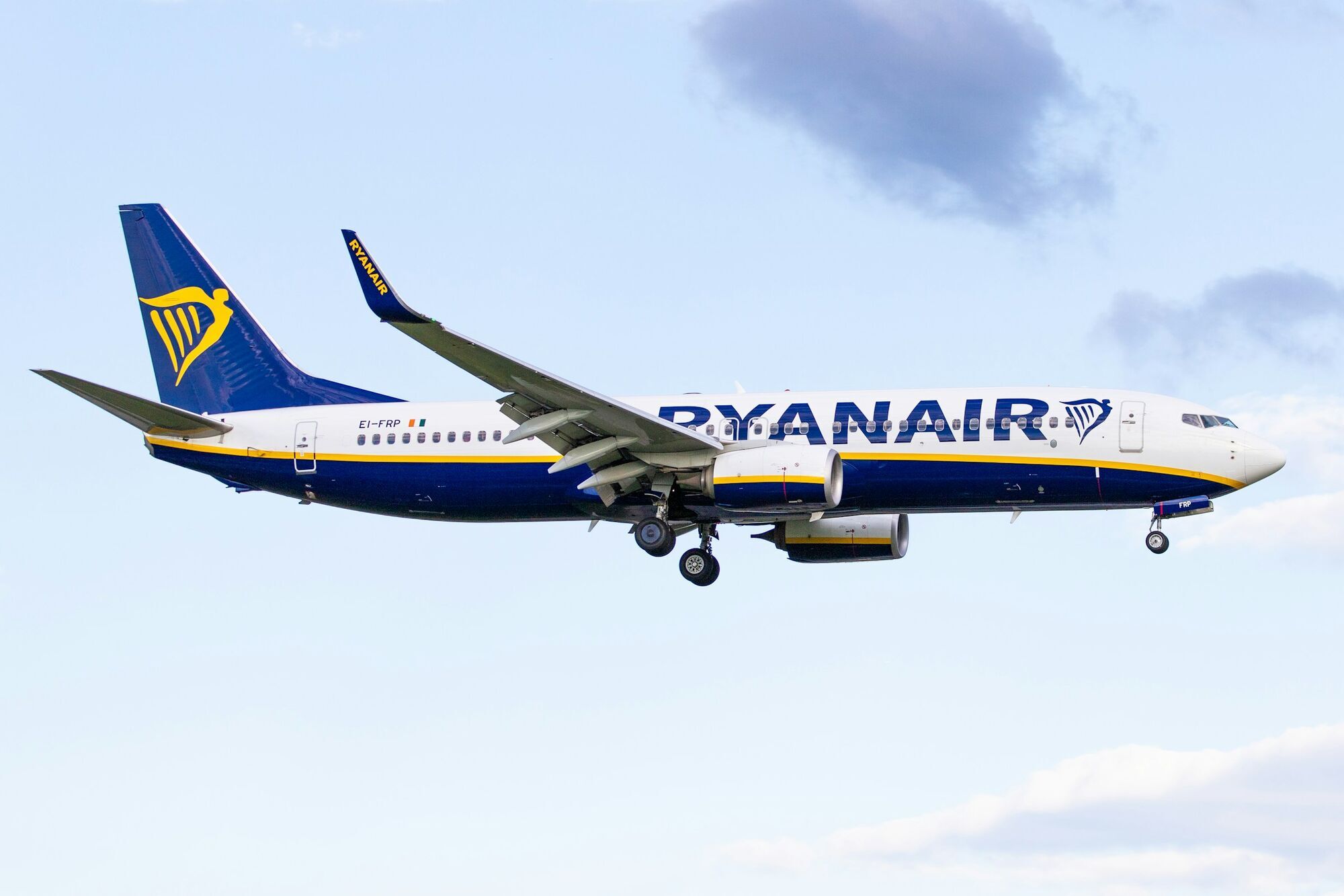 Ryanair aircraft in flight with its landing gear extended