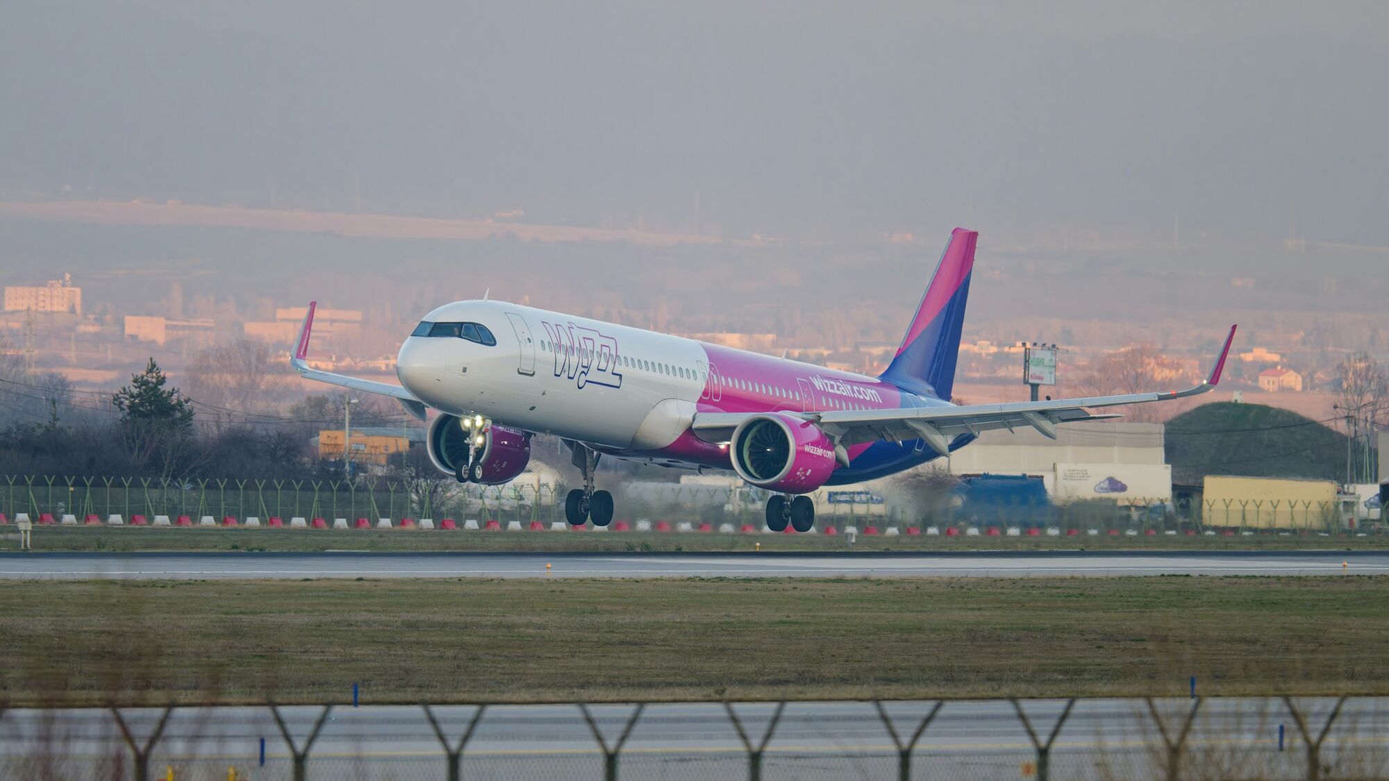 Wizz Air passenger aircraft landing on a runway