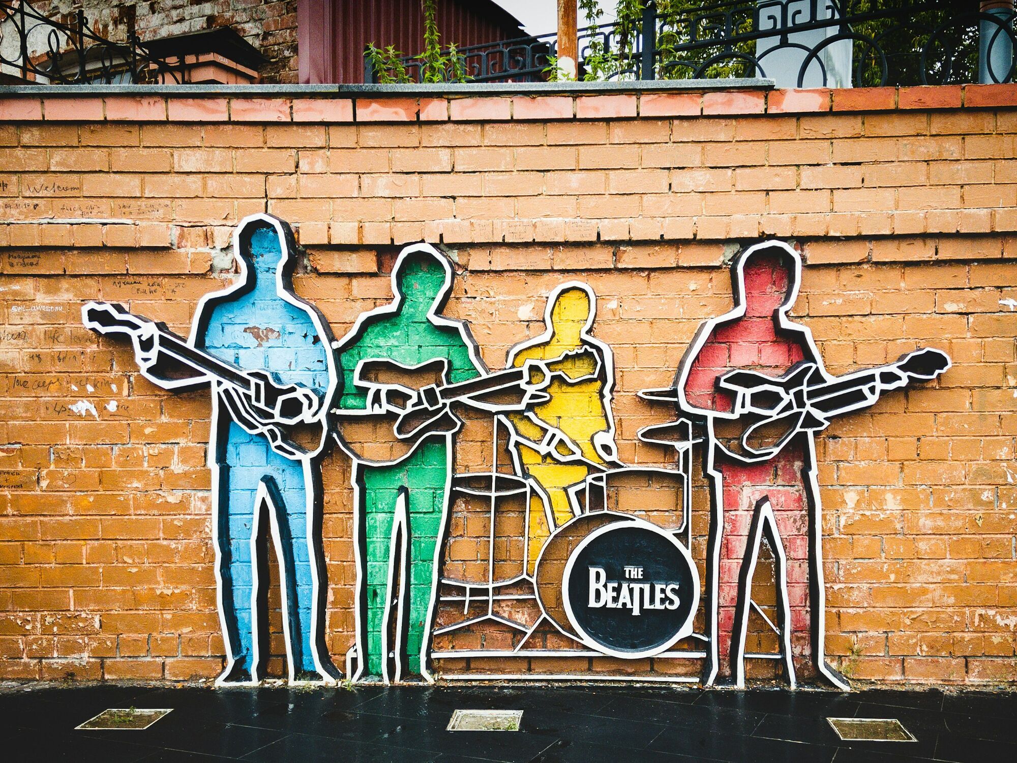 Colourful Beatles street art on a brick wall