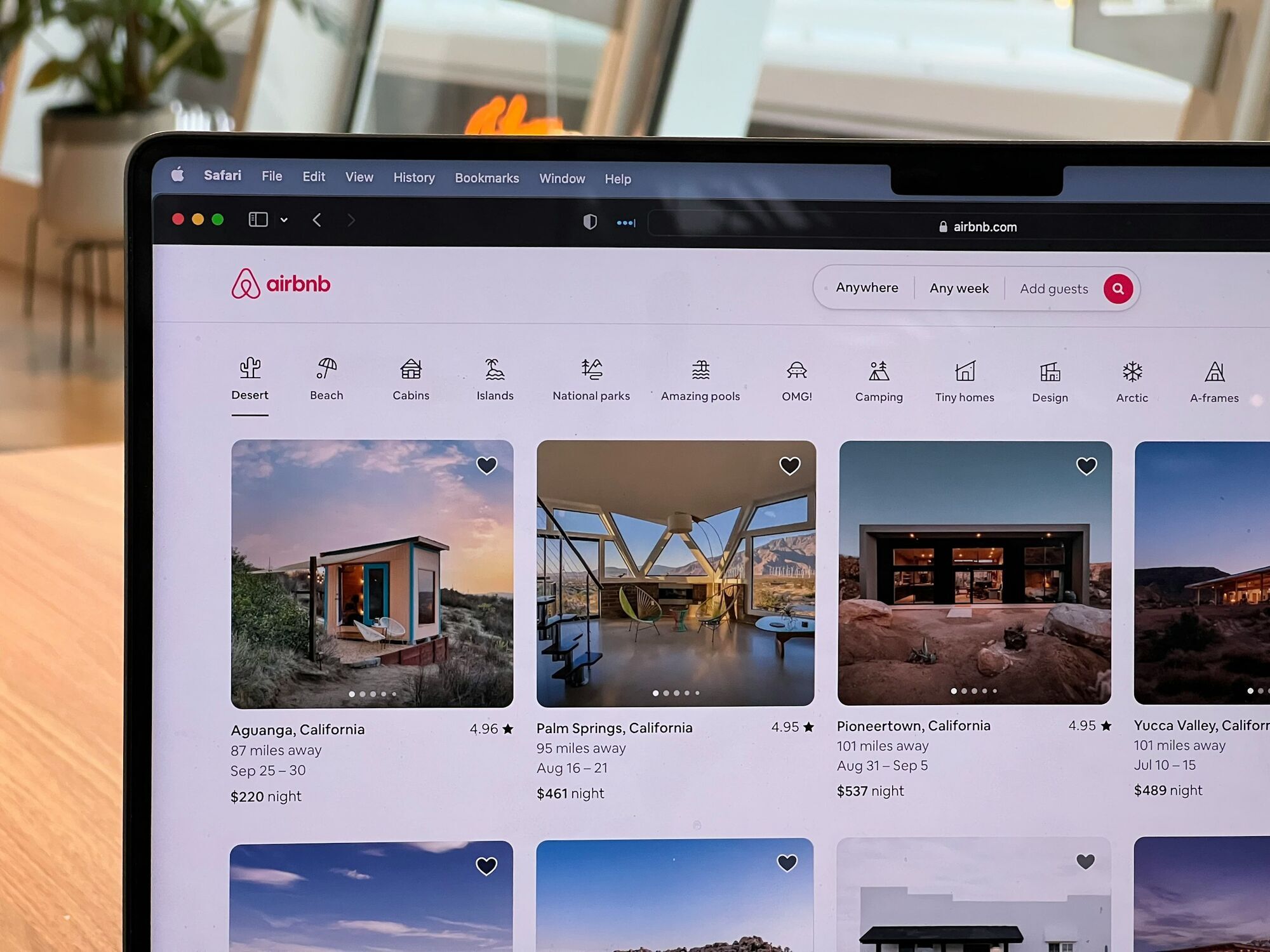 Airbnb holiday rental listings displayed on a laptop screen