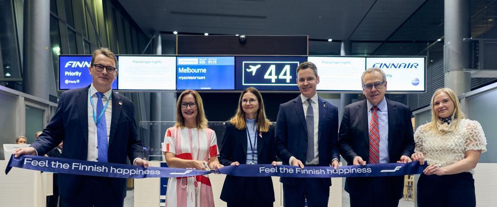 Finnair representatives at a ribbon-cutting ceremony for the Melbourne route at Helsinki Airport