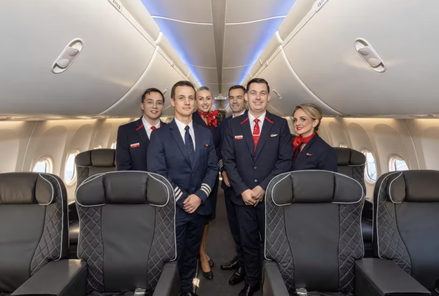 Jet2 pilots and cabin crew standing inside a business-class aircraft cabin