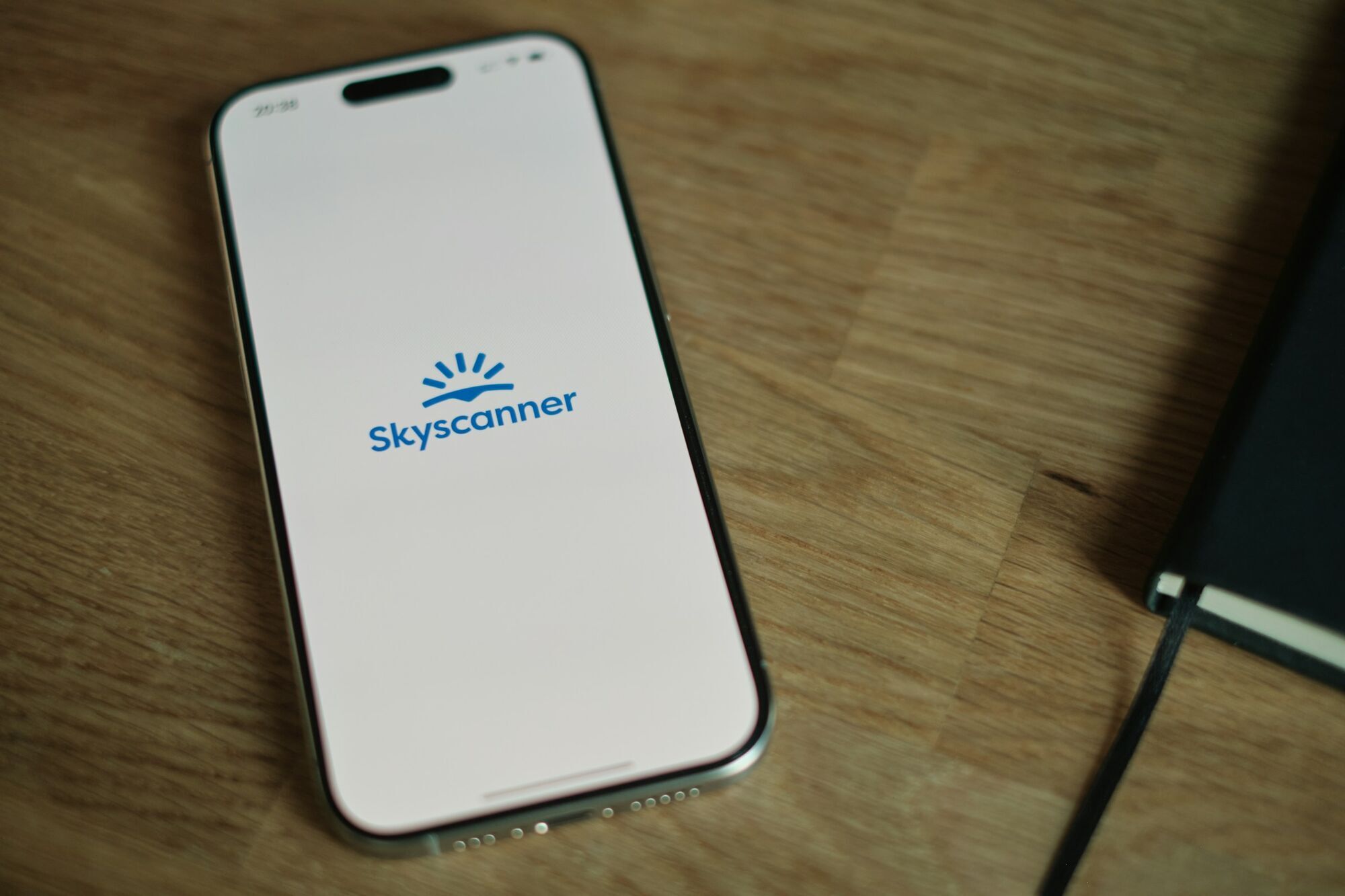 Skyscanner logo displayed on a smartphone screen