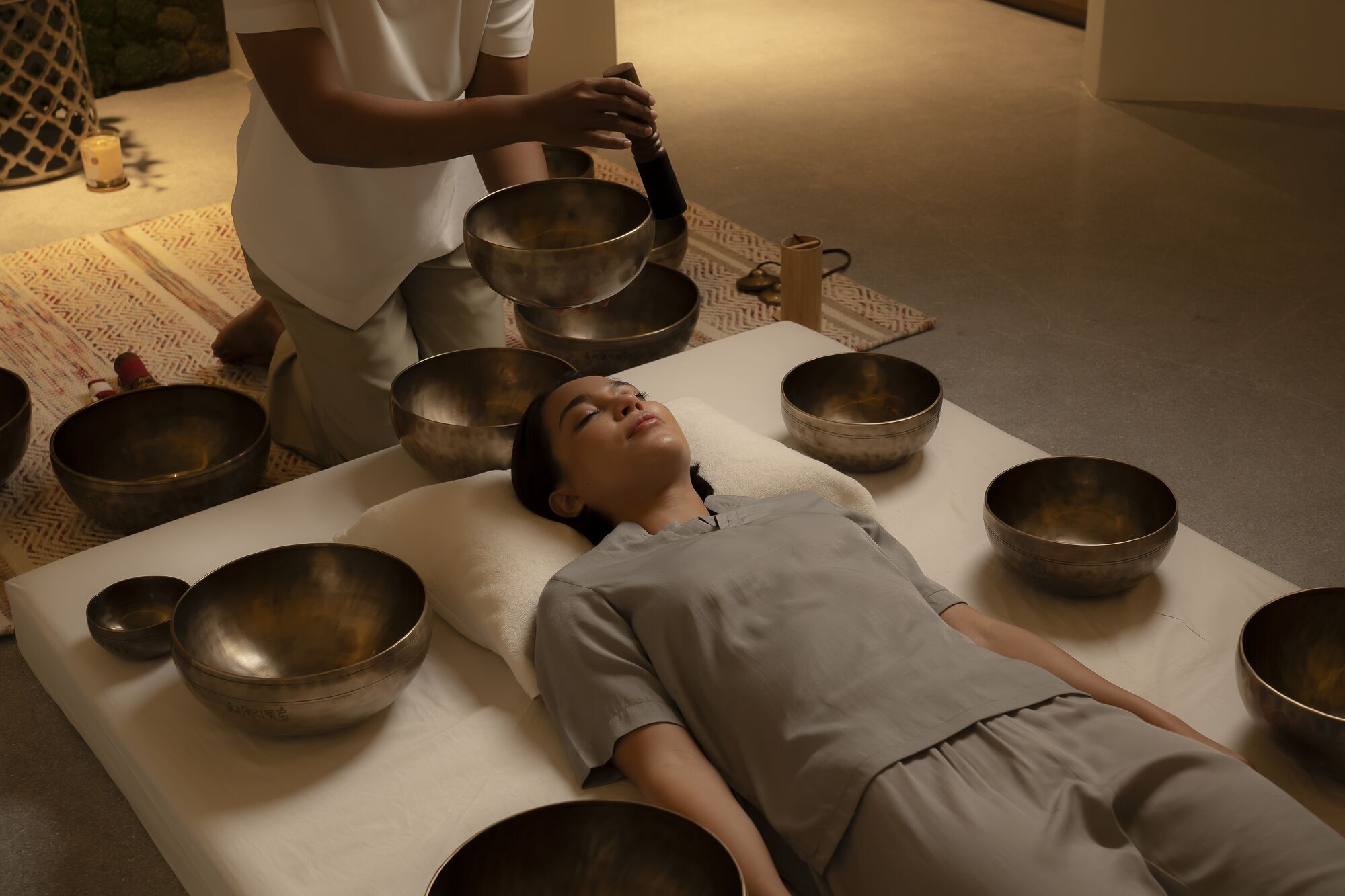 Guest receiving a singing bowl session at Anantara Koh Yao Yai