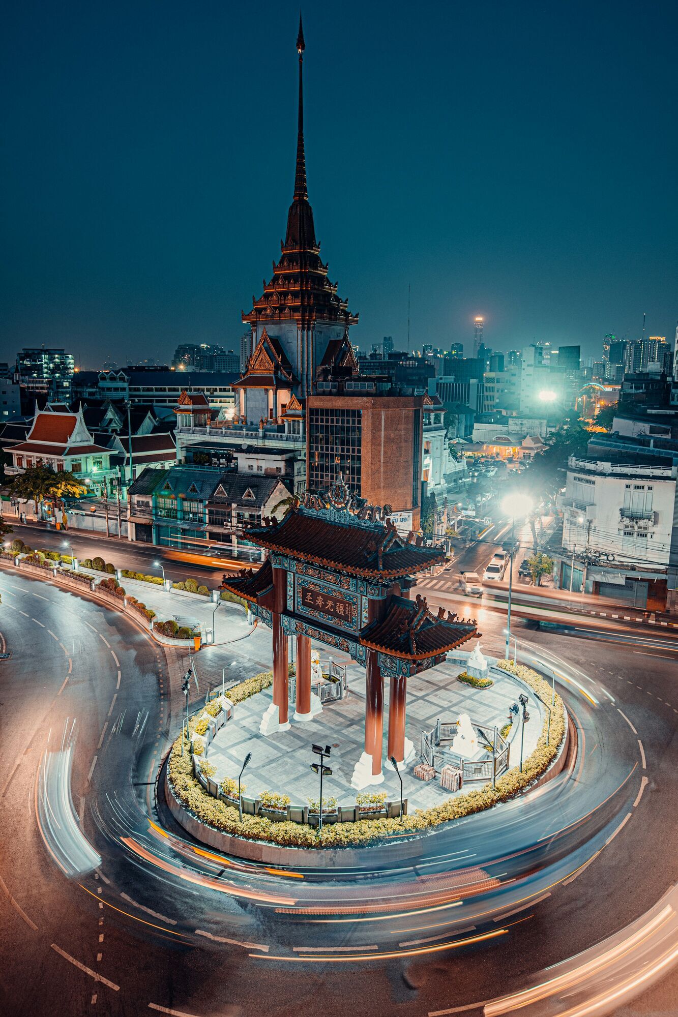 Bangkok's Chinatown Gate and Wat Traimit illuminated at night