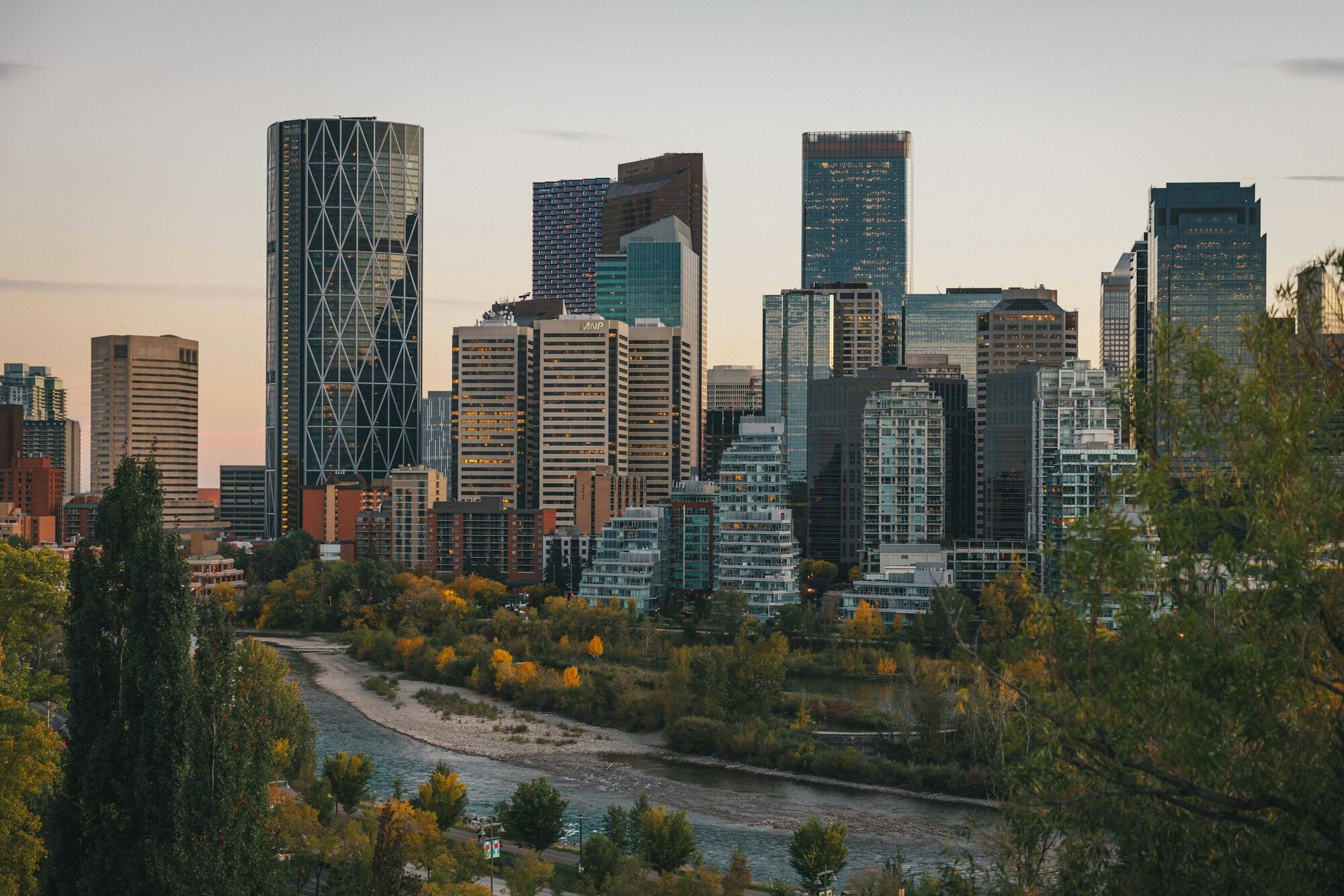 Calgary skyline overlooking a river in autumn